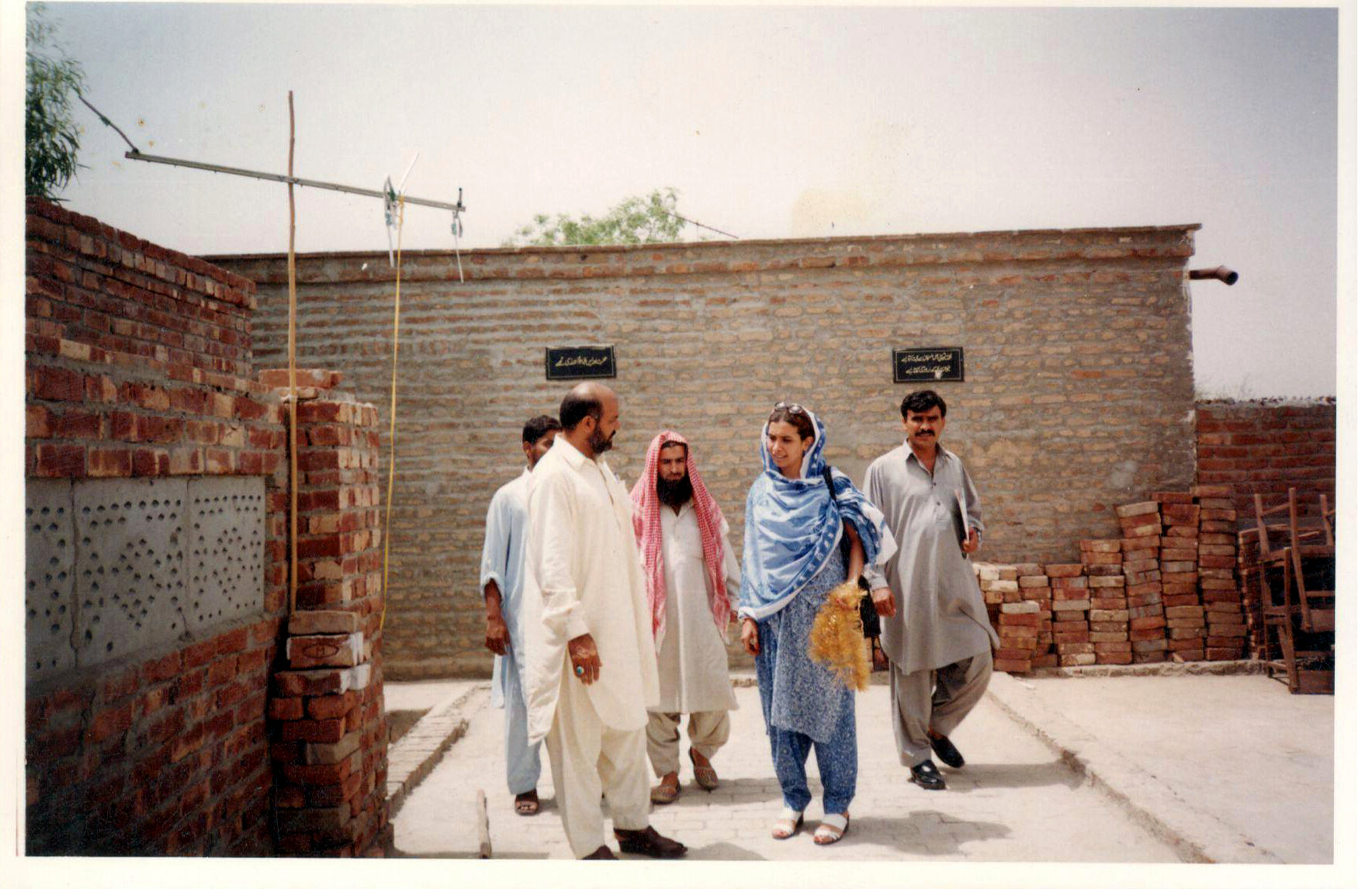 Programme representatives visiting a community rehabilitation site