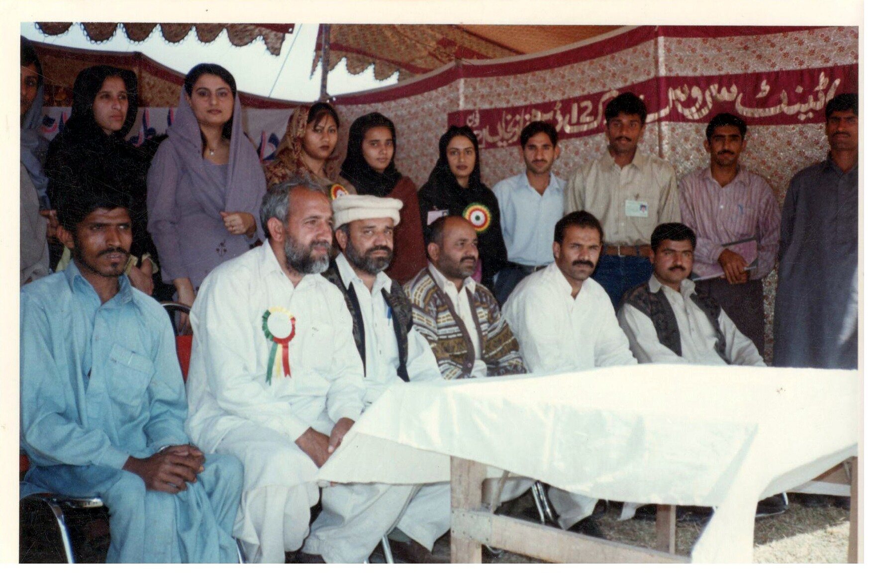 Women and men attending a public consultation