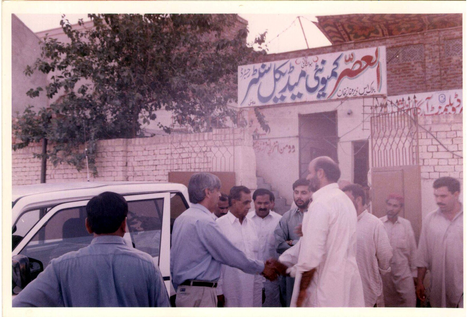 Community members gathered outside an outreach centre