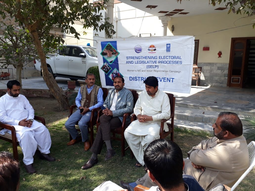 Community members discussing inclusive electoral participation