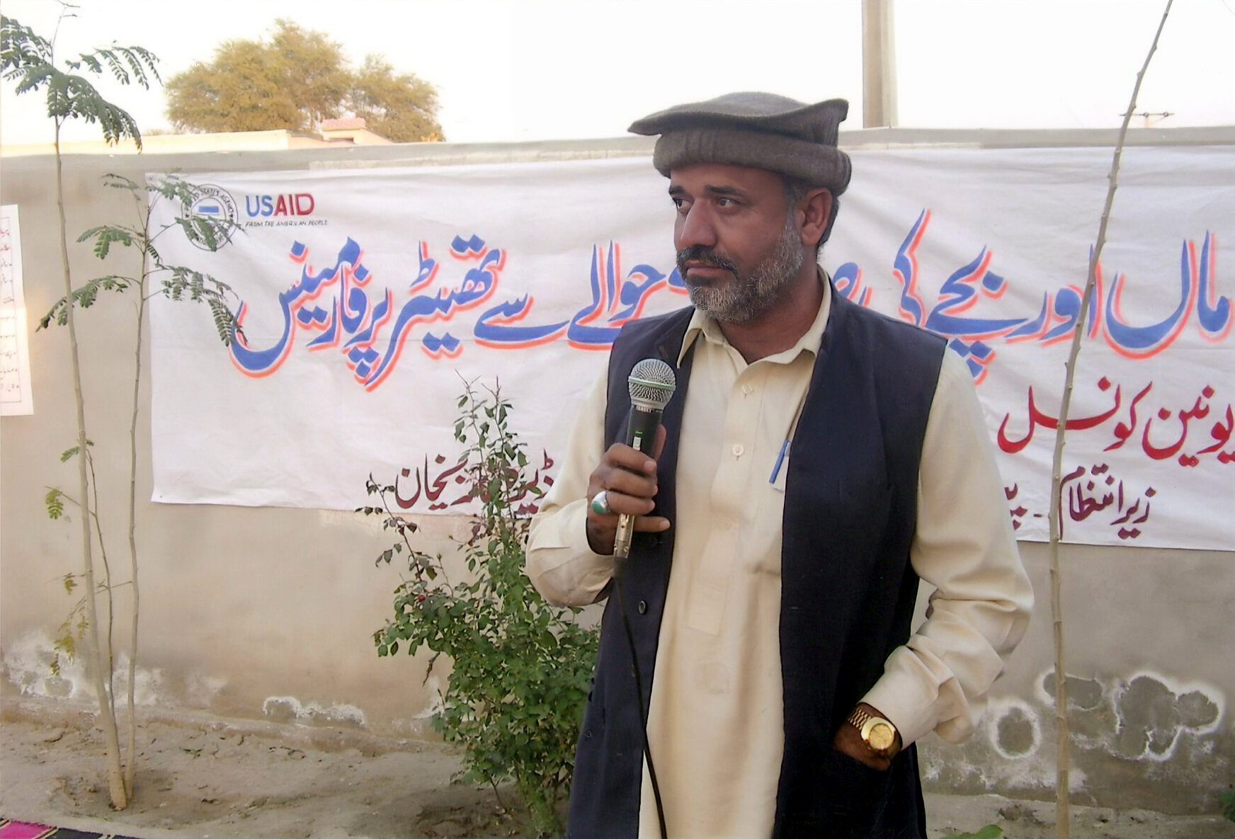 Community representative addressing a public advocacy event