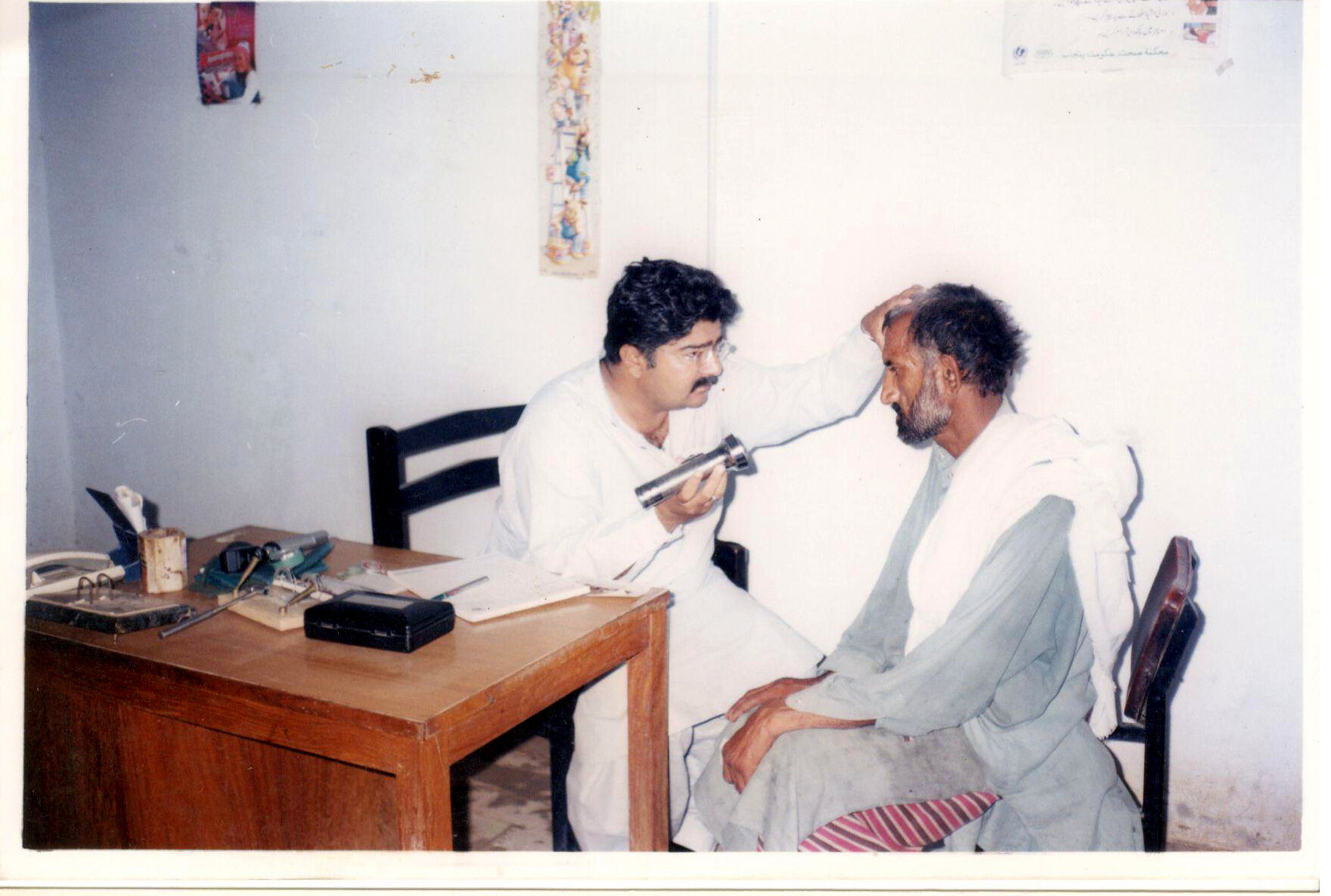 Staff member consulting a community resident