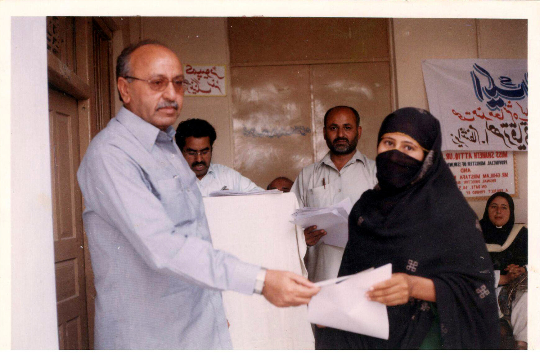 Woman receiving assistance at a community support activity