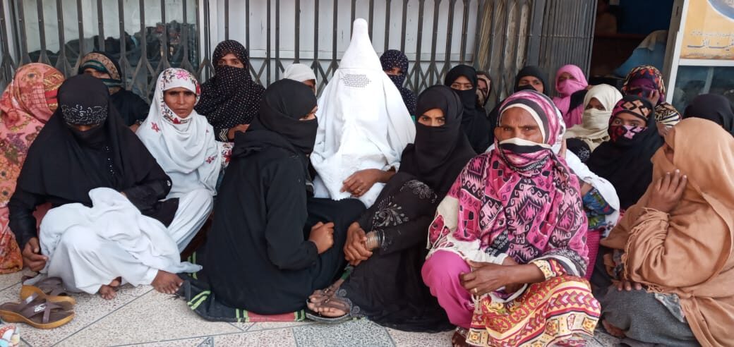 Women gathered for a community support activity