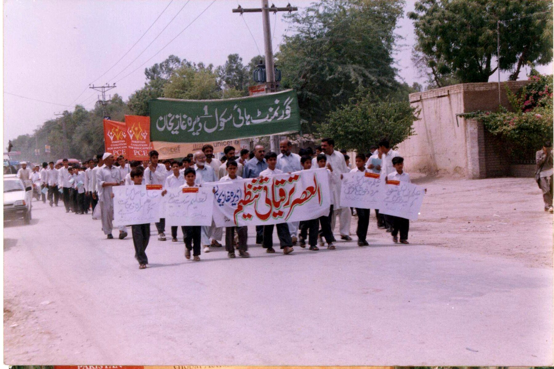 Students and community members participating in an education-awareness march
