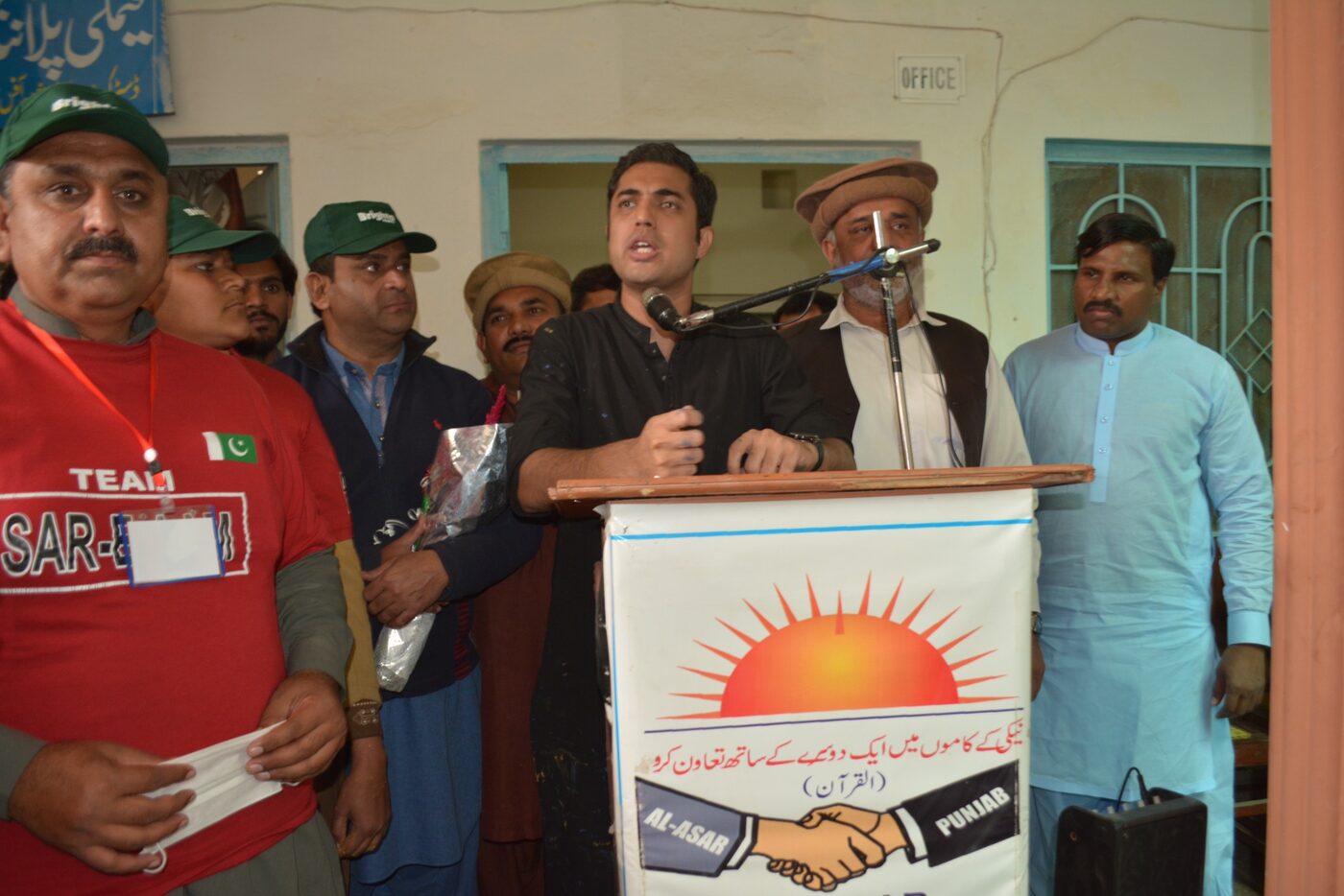 Community representative speaking at a programme event