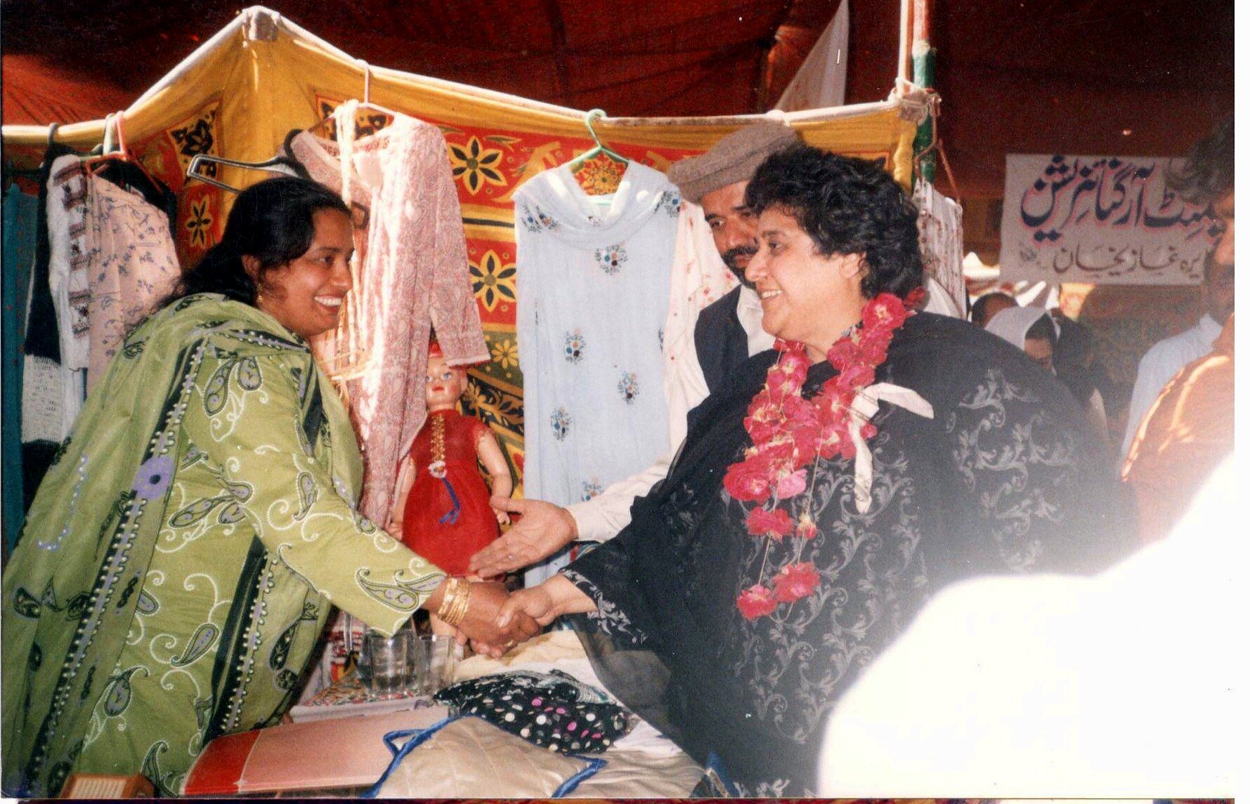 A vocational programme participant being recognized at a boutique exhibition