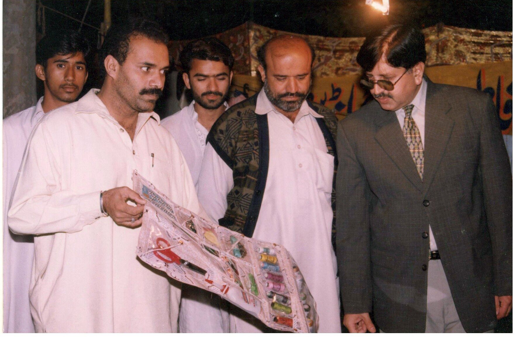 Visitors reviewing products prepared through a vocational programme