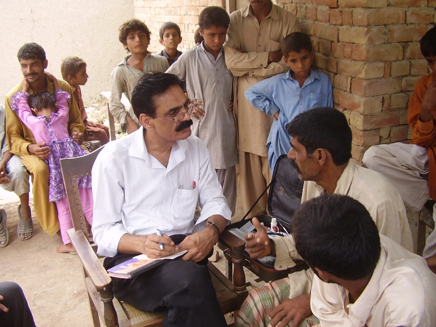 Healthcare worker examining a community member