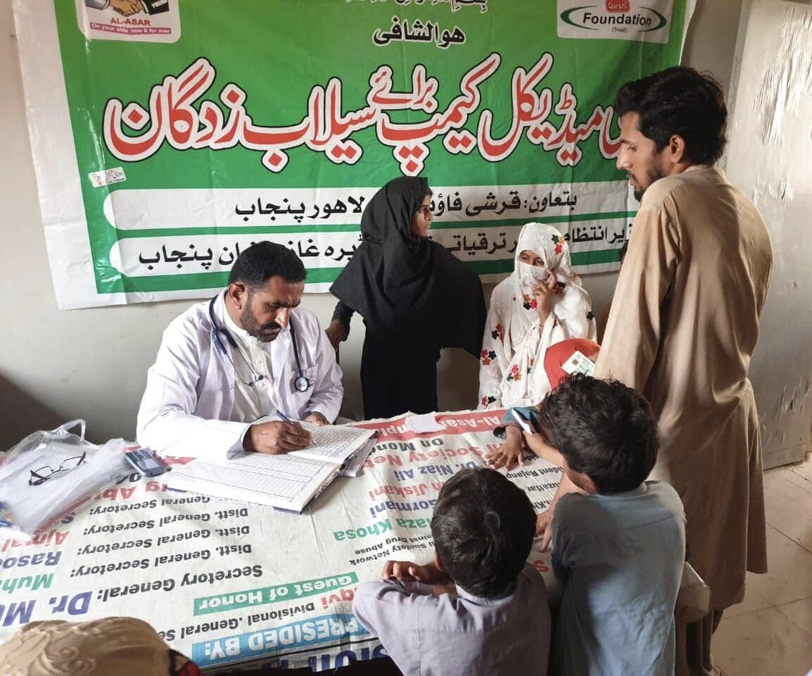 Doctor registering and consulting patients at a medical camp