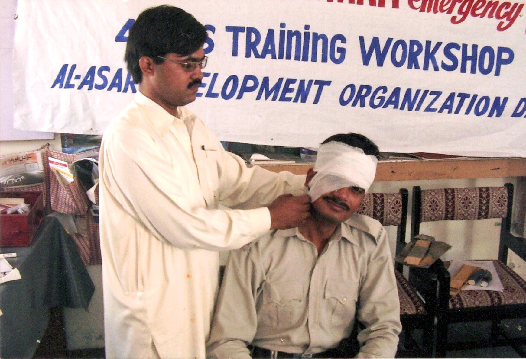 Facilitator demonstrating first aid during a Paiman training workshop
