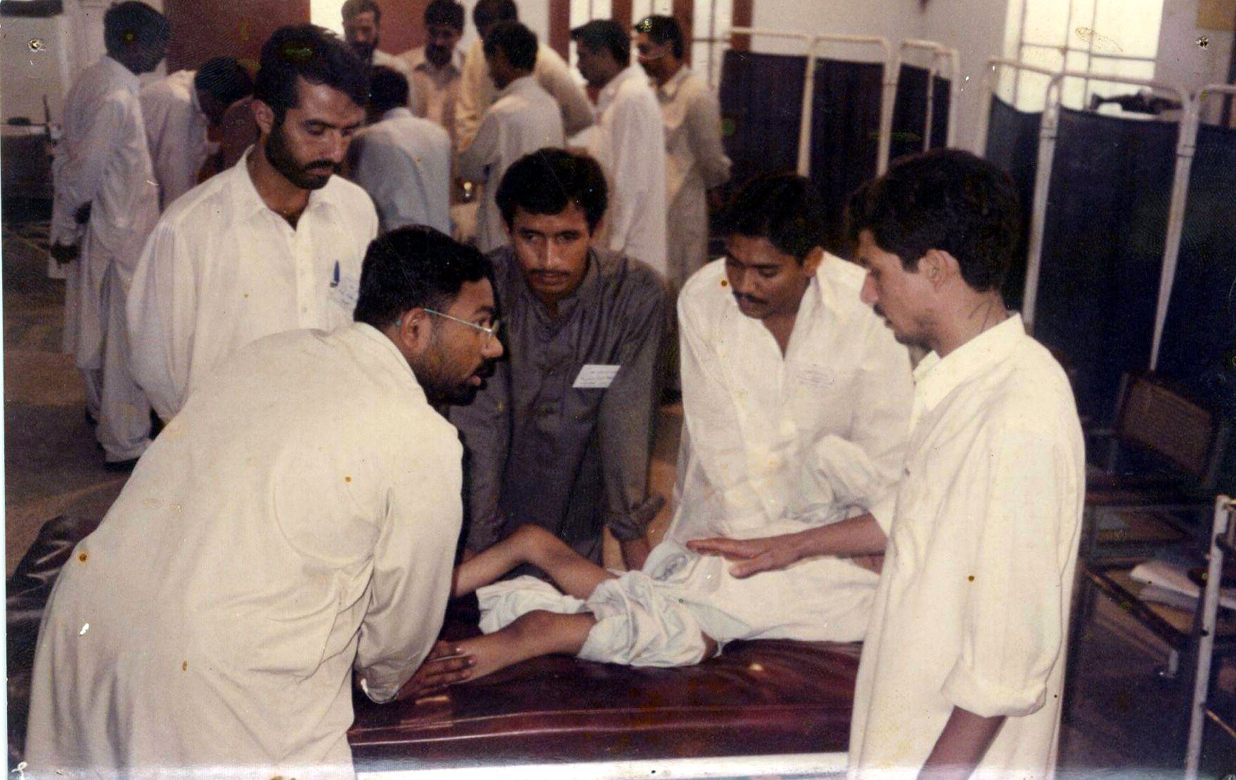 Physiotherapy rehabilitation session with patient and care team